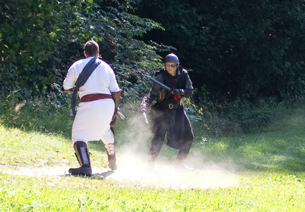 Fighters from host of Light and host of Darkness in duel.